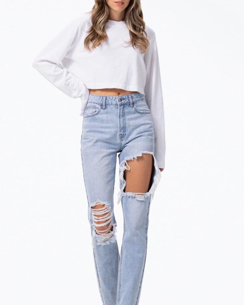 Front of a model wearing a size 9/L High-Rise Distressed Tapered Jeans In Light Blue in Light Blue by Jelly Jeans. | dia_product_style_image_id:359901